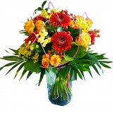 A bouquet of roses, gerberas, carnations and green additions
